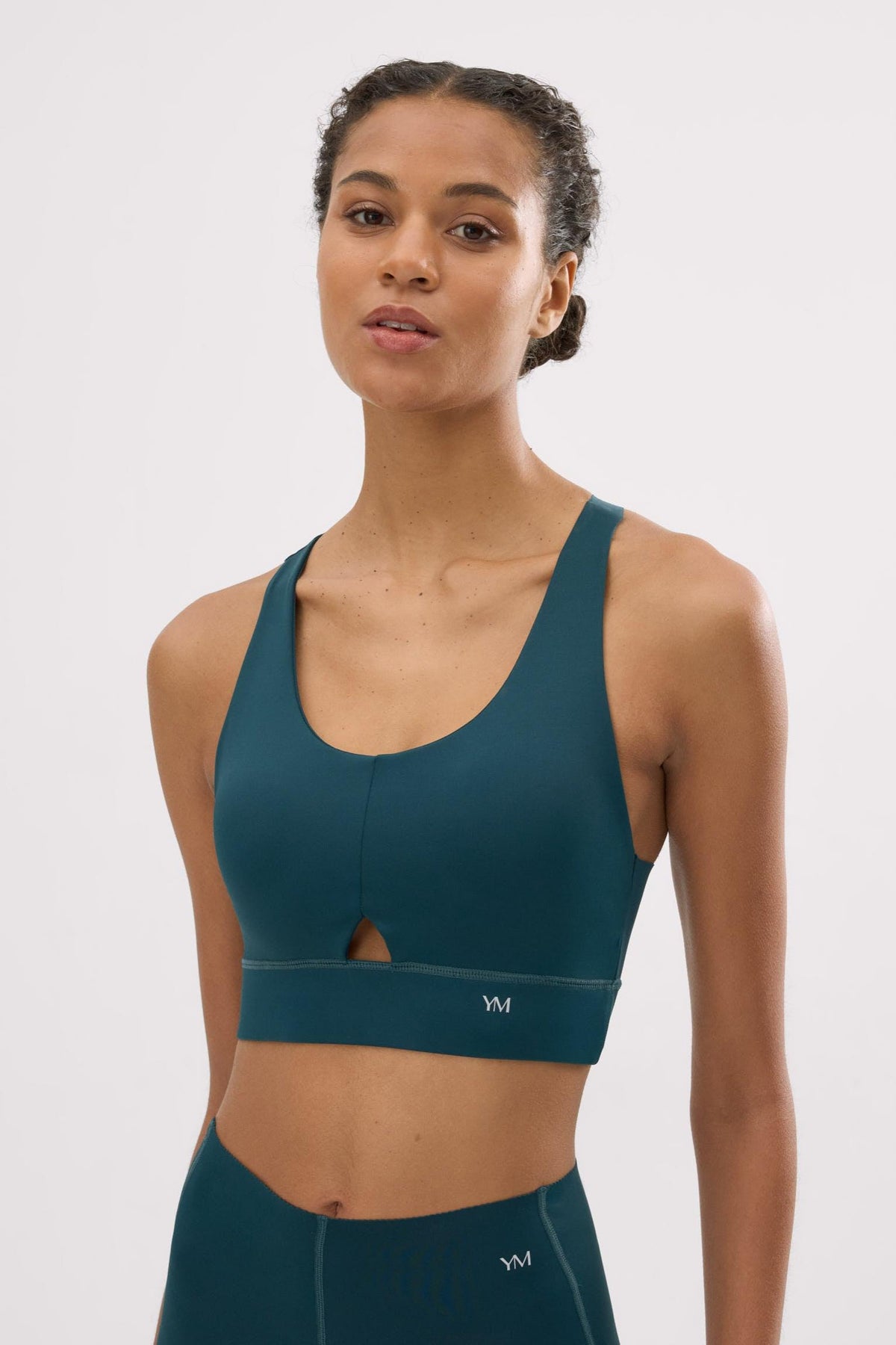 Top deportivo Compressive con detalle de abertura verde botella